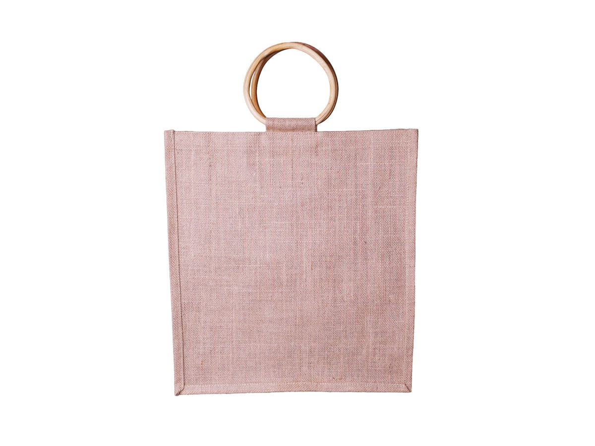 A natural jute shopping bag, featuring two round light brown cane handles, facing straight on, shown against a plain white background.