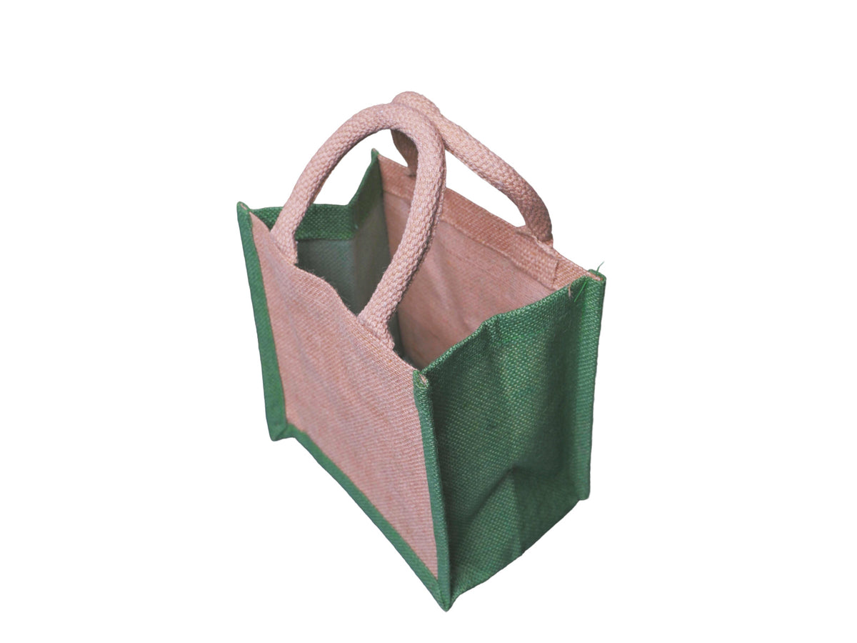 A jute tote bag, featuring a natural front and back panels and sides, and green side panels, natural cotton cord handles, facing 45 degrees to the left from an angled aerial view, shown against a plain white background.